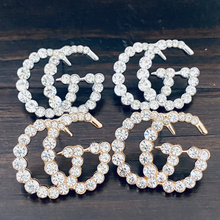 Load image into Gallery viewer, Strike Twinkle Studded Earrings. Make a statement with these stunning Designer Inspired studded earrings. Give any look that extra glam and shine it needs to twinkle like the stars! An Emma Sofia favorite. Available in Silver and Gold. 2.9 cm Please follow jewelry care instructions to maintain your pieces quality and integrity. #shopemmasofia