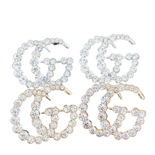 Load image into Gallery viewer, Strike Twinkle Studded Earrings. Make a statement with these stunning Designer Inspired studded earrings. Give any look that extra glam and shine it needs to twinkle like the stars! An Emma Sofia favorite. Available in Silver and Gold. 2.9 cm Please follow jewelry care instructions to maintain your pieces quality and integrity. #shopemmasofia