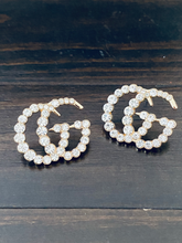 Load image into Gallery viewer, Strike Twinkle Studded Earrings. Make a statement with these stunning Designer Inspired studded earrings. Give any look that extra glam and shine it needs to twinkle like the stars! An Emma Sofia favorite. Available in Silver and Gold. 2.9 cm Please follow jewelry care instructions to maintain your pieces quality and integrity. #shopemmasofia