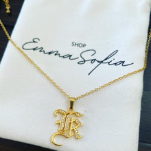Load image into Gallery viewer, Stunning studded old english initial pendant necklace. Wear you own initial or honor someone special in your life. Available in gold. Pendant 2 cm Chain 45 cm Please follow care instructions to maintain your pieces quality and integrity. #shopemmasofia