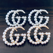 Load image into Gallery viewer, Strike Pearl Studded Earrings.  Romantic pearl edition of the strike Designer Inspired studded earrings. Pair perfectly with your favorite set of pearls or layered pendants. Available in Silver and Gold.  3 cm     Please follow jewelry care instructions to maintain your pieces quality and integrity. #SHOPEMMSOFIA
