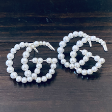 Load image into Gallery viewer, Strike Pearl Studded Earrings.  Romantic pearl edition of the strike Designer Inspired studded earrings. Pair perfectly with your favorite set of pearls or layered pendants. Available in Silver and Gold.  3 cm     Please follow jewelry care instructions to maintain your pieces quality and integrity. #SHOPEMMSOFIA

